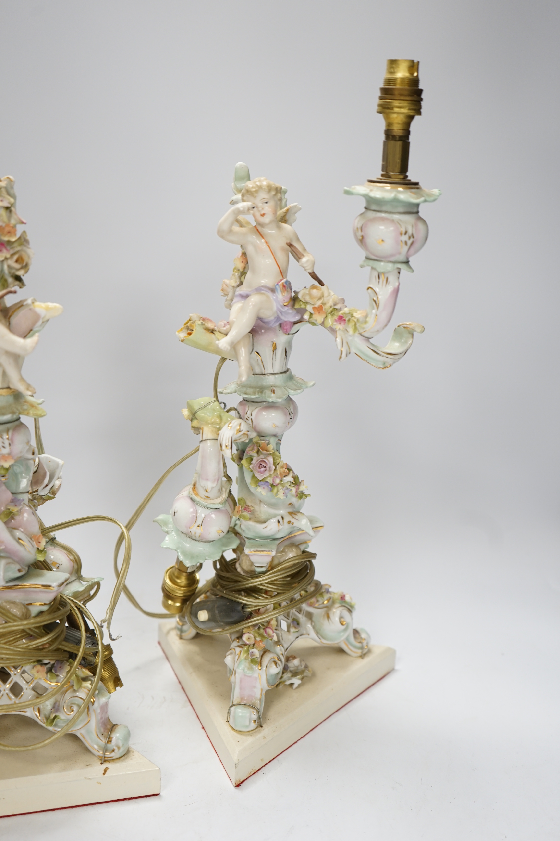 A pair of Sitzendorf floral encrusted porcelain table lamps, 42cm total